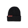 A black ribbed beanie is shown, sporting a red and black checkered band on the cuff, complemented by a small triangular logo tag.