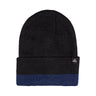 This shows a black ribbed beanie that features a blue block on the cuff, complemented by a small triangular logo.