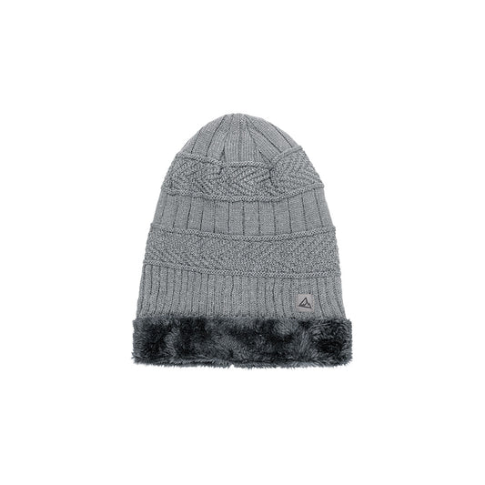 This is a gray heavy knit beanie featuring a cable knit design, a ribbed fold-over cuff, and a fluffy gray faux fur band. A small triangular logo is placed on the cuff.