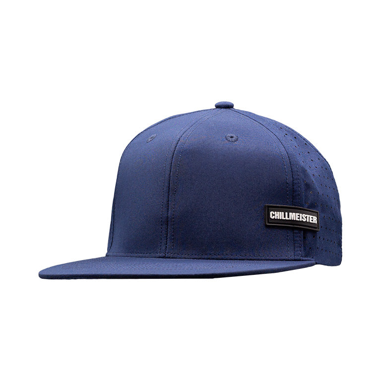 Navy flatbill hat featuring breathable perforated sides and a black-and-white Chillmeister patch.