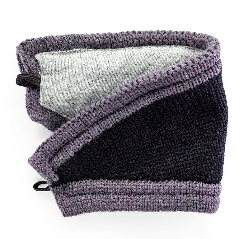 A black mask with gray trim detached from beanie