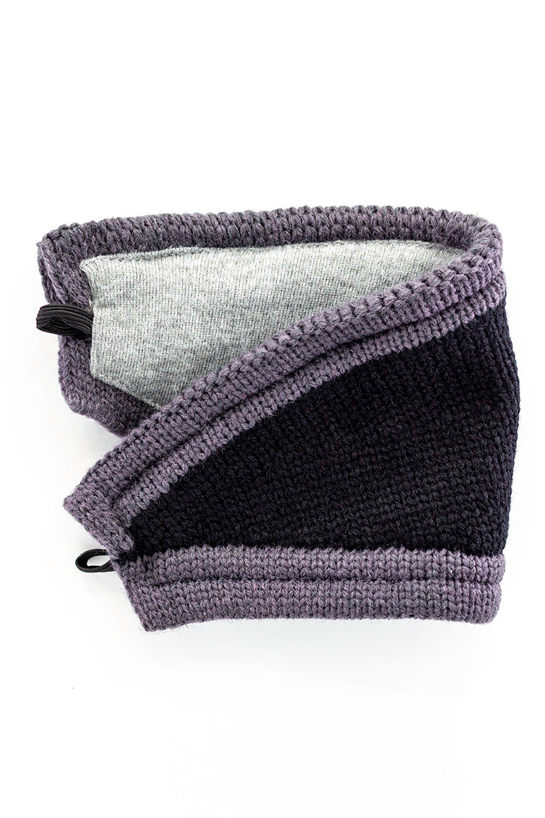 A black mask with gray trim detached from beanie